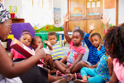 children raising hands