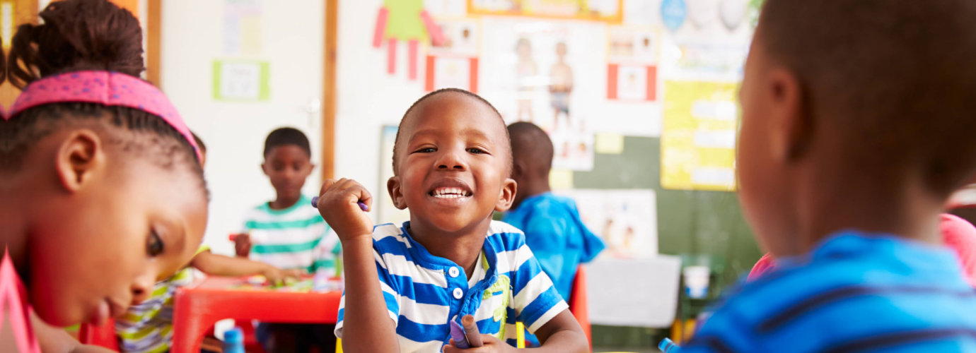 boy smiling in a class