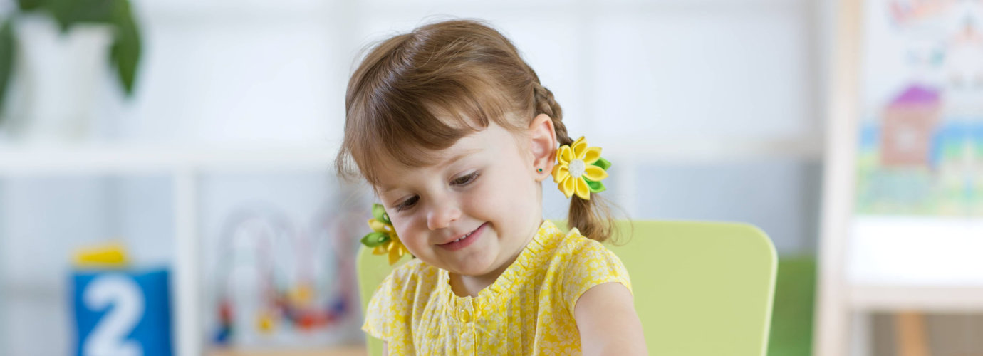 cute female toddler playing indoor