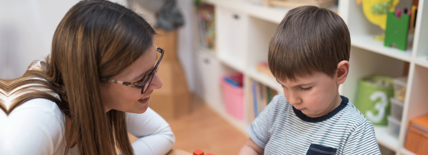 teacher talking to her student